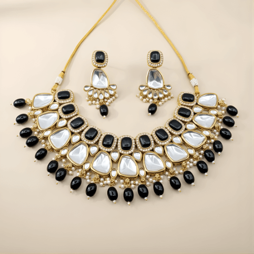 Jewelry set with necklace and earrings on a beige background