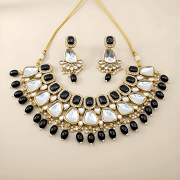 Jewelry set with necklace and earrings on a beige background
