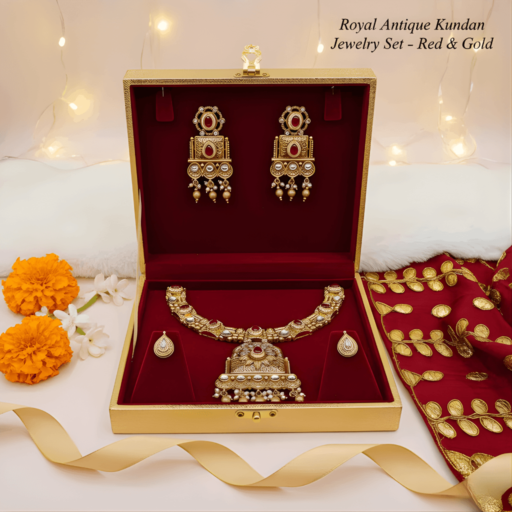 Royal Antique Kundan Jewelry Set in a gold and red box with decorative elements.