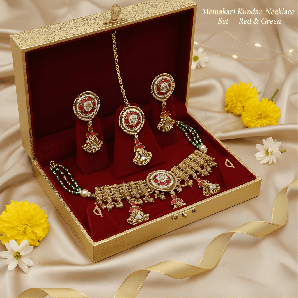 Meinakari Kundan necklace set in a gold and red box with yellow and white flowers.