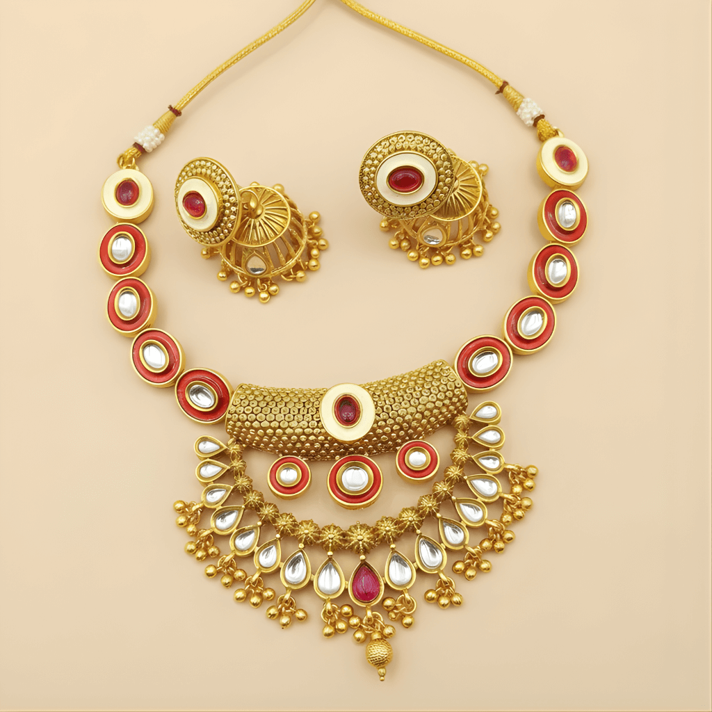Gold jewelry set with necklace, earrings, and bangles on a beige background
