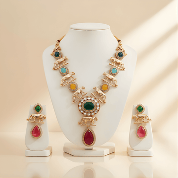 Jewelry set with necklace and earrings on a white stand against a beige background
