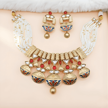 A gold and pearl necklace with matching earrings, featuring red, white, and blue enamel designs. The set exudes elegance and luxury against a soft background.