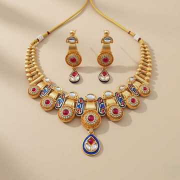Gold necklace with colorful gemstones on a beige background
