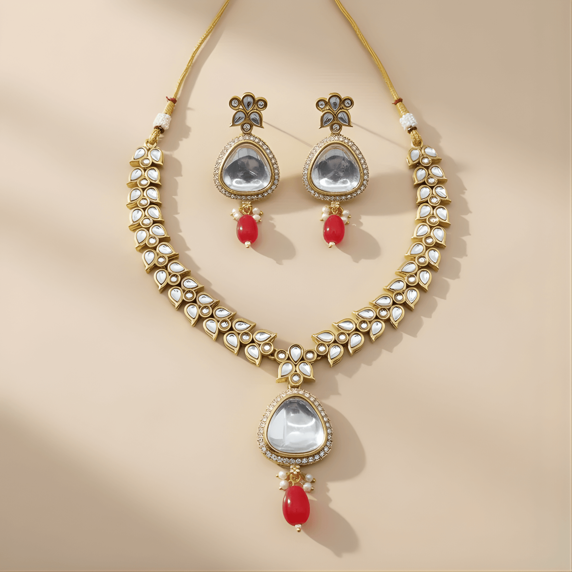 Jewelry set with necklace and earrings on a beige background