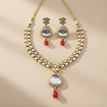 Jewelry set with necklace and earrings on a beige background